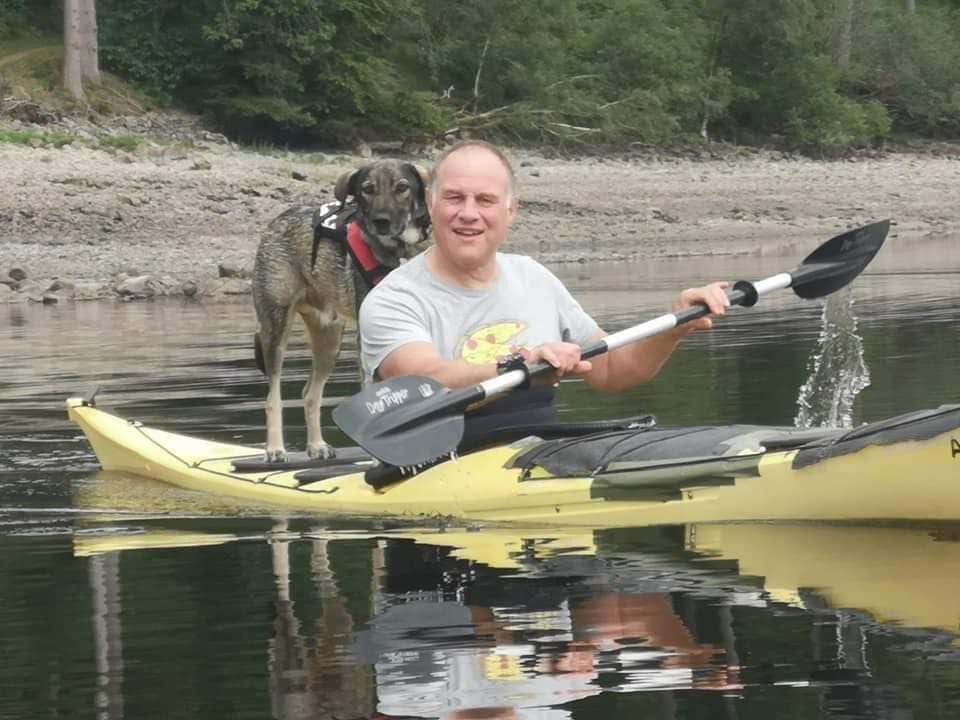 Bailey a brown Romanian rescue dog on a kayak | 1 Dog At a Time Rescue UK